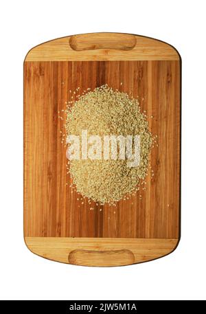 A handful of white sesame seeds on a white background Isolated Stock A handful of white sesame seeds on a white background Isolated Stock