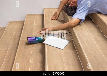 Senior man falling down stair by hypertension Stock Photo