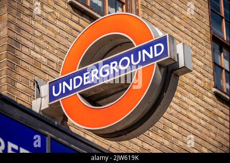 London, UK - August 22, 2022: Station name sign on the platform of Goodge Street underground station. London Underground is the oldest underground rai Stock Photo