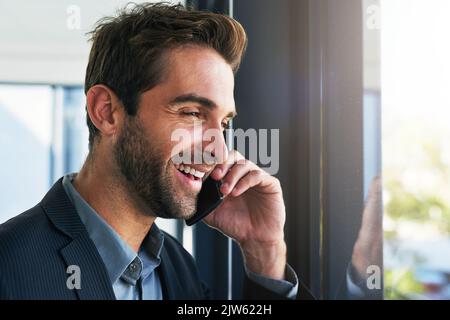 Always trying to make new business deals. a handsome young businessman in the office. Stock Photo