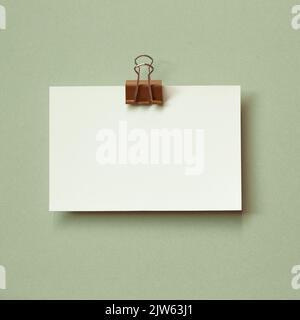 Blank memo pad on green background. copy space Stock Photo