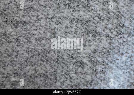 Grey wool knitted fabric texture close up background Stock Photo