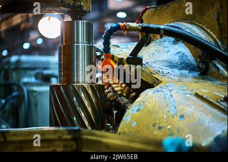 Processing helical gear with old modular hob machine tool Stock Photo