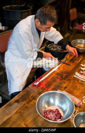 Preparing eel for cooking Narita Japan 5 Stock Photo