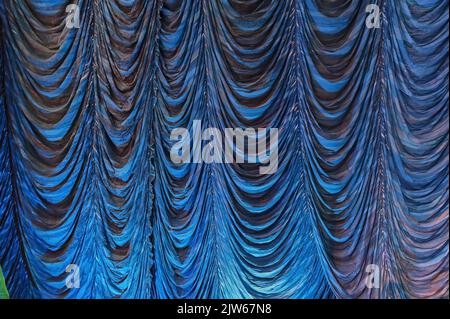 Austrian pleated main front stage curtain with blue highlight Stock Photo