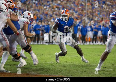 Florida running back Montrell Johnson Jr. (2) rushes for yardage past ...