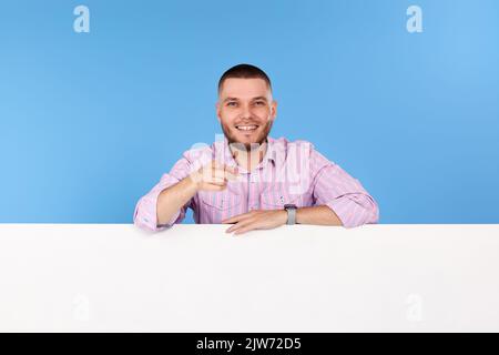cheerful man holding board with empty copy space Stock Photo