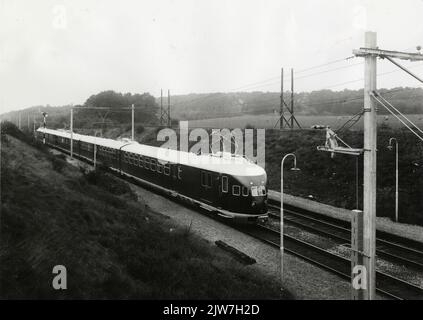 Image of two linked electric train sets matt. 1936 of the N.S. (First set no. 613) in Oosterbeek high. Stock Photo