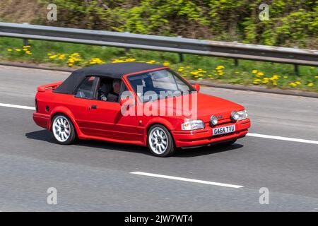 1990 90s nineties Red FORD ESCORT RS TURBO XR3i 1597cc petrol 5 speed manual; travelling on the M6 motorway, UK Stock Photo