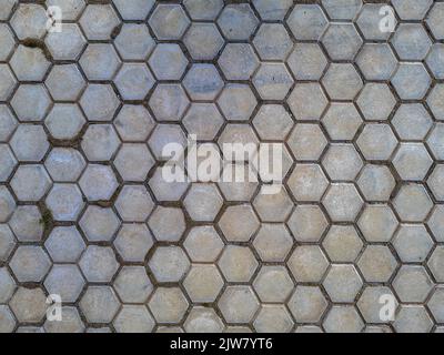 Street hexagonal clay tiles Hexagon honey comb pattern background texture Stock Photo