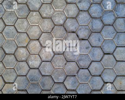 Street hexagonal clay tiles Hexagon honey comb pattern background texture Stock Photo