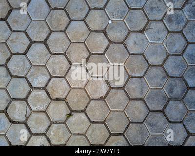Street hexagonal clay tiles Hexagon honey comb pattern background texture Stock Photo