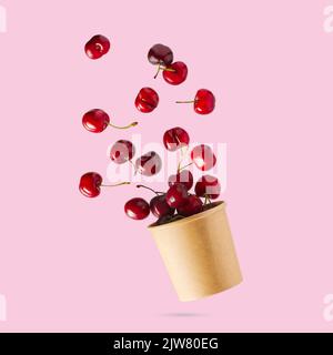 Set of falling ripe cherries. Banner design. Flying fruit as package design element. Stock Photo