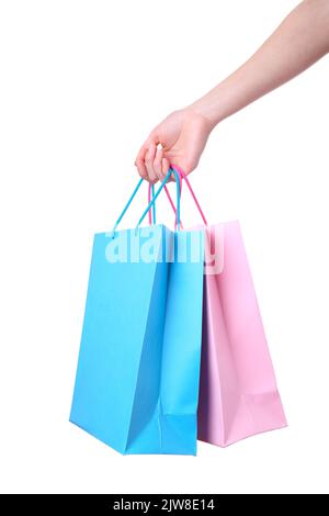 Hand holding colorful paper bags isolated on white background shopping concept Stock Photo