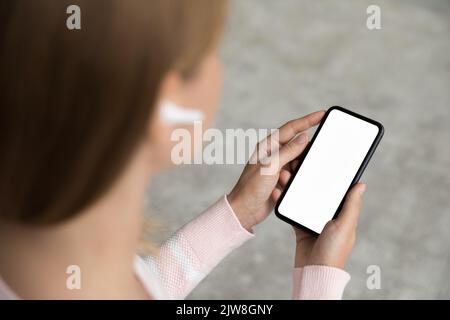Smartphone with blank empty screen copy space in female hands Stock Photo