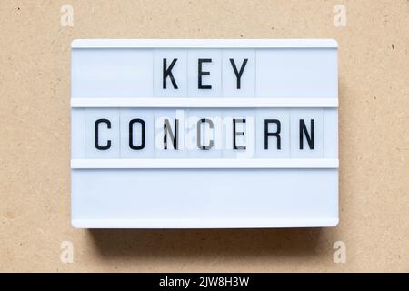 Lightbox with word key concern on wood background Stock Photo