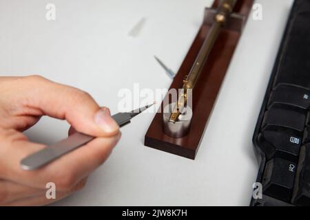Transmission electron microscope sample holder been loaded with an ...