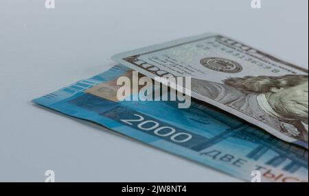 Russian Ruble and 100 US dollars, Ruble banknote and US 100 dollar Wallpaper business and finance Stock Photo