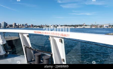 View from the top dect of the Dartmouth to Halifax Nova Scotia ferry as it leaves the terminal in Dartmouth. Stock Photo