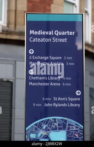 Direction sign to the Medieval Quarter in Manchester- MANCHESTER, UK - AUGUST 15, 2022 Stock Photo