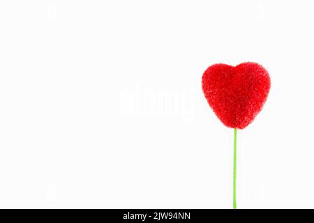 Red felt heart is A symbol of love on a white background. Decorative elements for design for Valentines Day, invitations, cover, wedding card Stock Photo