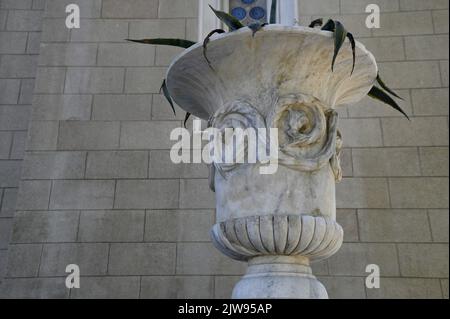 Handmade stone carved urn on the exterior of the Metropolitan Cathedral of Athens in Greece. Stock Photo