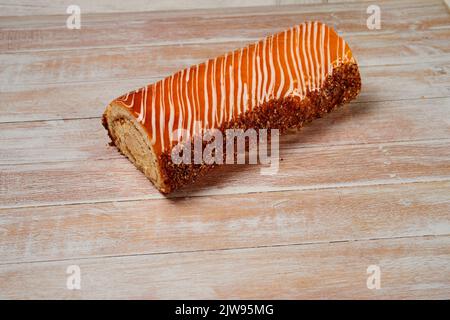 swiss chocolate roll, roll, cream roll, swiss log. Sold in a supermarket. Plastic box. Biscuit, jam and cream. Stock Photo