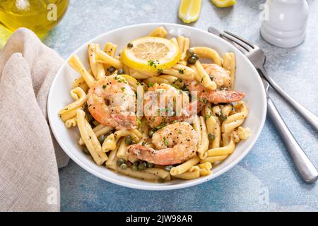 Shrimp piccata pasta with lemon and parmesan Stock Photo