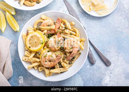 Shrimp piccata pasta with lemon and parmesan Stock Photo