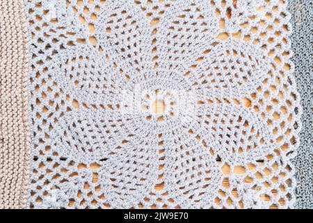 Knitted pattern of gray wool in form of close-up flower Stock Photo
