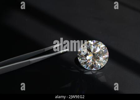 Big Carat Diamond Gemstone on black background Stock Photo