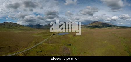 drone panorama landscape of Connemara National Park and the Twelve Bens mountains in western Ireland Stock Photo