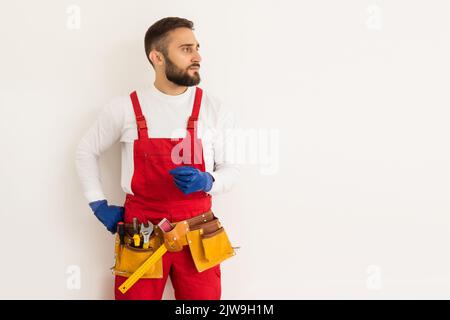 Male worker in a uniform posing isolated on white background Stock Photo