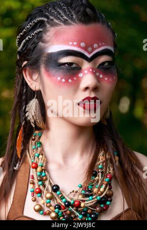 Outdoor close-up portrait of the beautiful young shamaness (witch doctor) Stock Photo