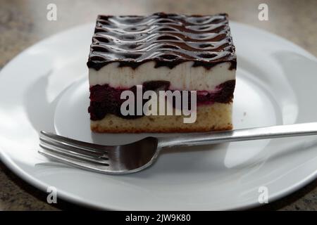 Cake 'Danube wave' on a plate with cake fork Stock Photo