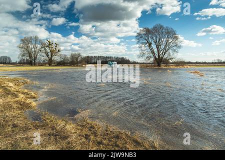 Flooded meadow after melting snow, the view on a February day Stock Photo