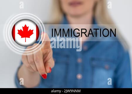 flag of canada and inscription immigration Stock Photo