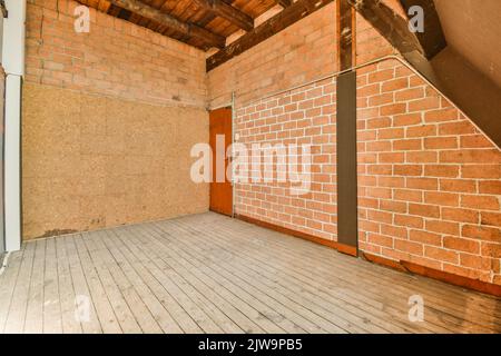 Interior of spacious apartment room on attic of building. Stock Photo