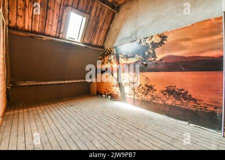 Interior of spacious apartment room on attic of building. Stock Photo