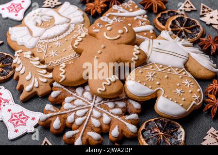 Christmas decorations and gingerbreads on a dark concrete table