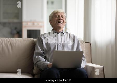 Cheerful happy customer man speaking on video call Stock Photo