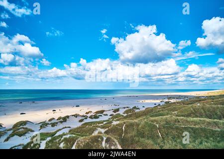 Clouds over the beach at the Jammerbugt in norther Jutland in Denmark. High quality photo Stock Photo