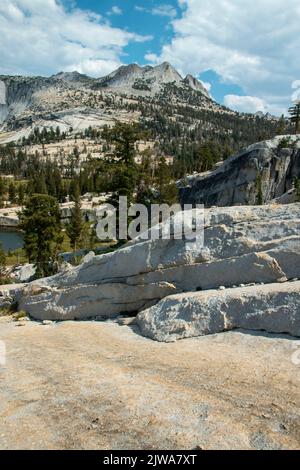 The trail to Upper Cathedral Lake begins in Tuolumne Meadows, in the eastern part of Yosemite National Park. Stock Photo