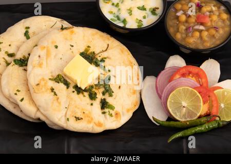 Chole Kulche Also Called Matar Kulcha, Chhole Kulche Is Widely Popular Delhi Street Food. The Dish Comprises Of Mildly Leavened Soft Fluffy Flatbread Stock Photo