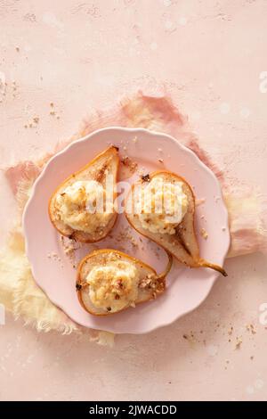 grilled pears baked with ricotta cheese and walnuts. honey topping Stock Photo
