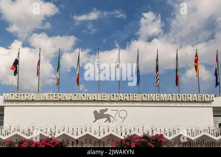 Sign and flags on the facade of the Cinema Palace, seat of the 79th Venice International Film Festival, Lido di Venezia, Veneto, Italy Stock Photo