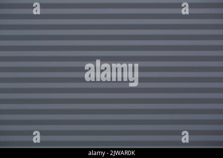 Black clear background with corrugated iron in horizontal orientation. Stock Photo