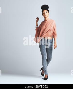 Life isnt perfect but your outfit can be. a fashionable young woman wearing a casual outfit. Stock Photo