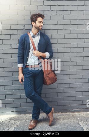 Effortlessly stylish. a stylishly dressed businessman outdoors. Stock Photo