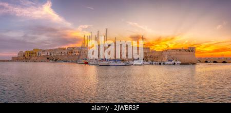 Landscape with Gallipoli town and harbour at sunset, Puglia Region, South Italy Stock Photo
